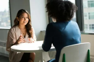 Two women professionals in conversation during an interview
