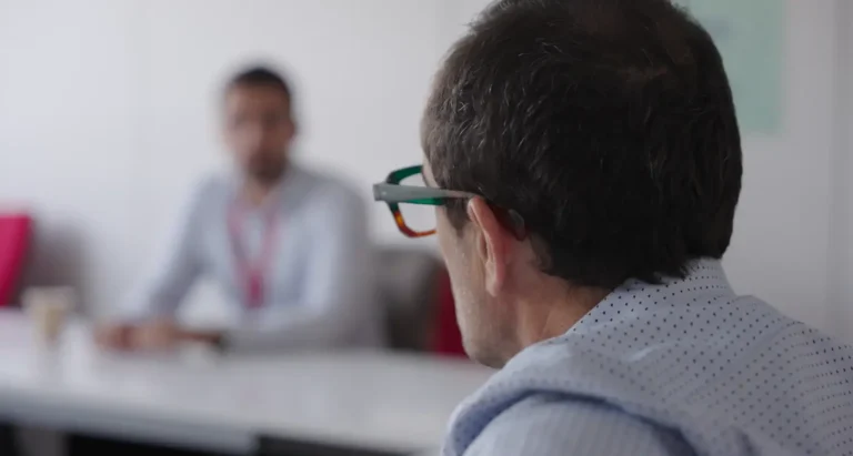 Two insurance professionals in conversation during an interview